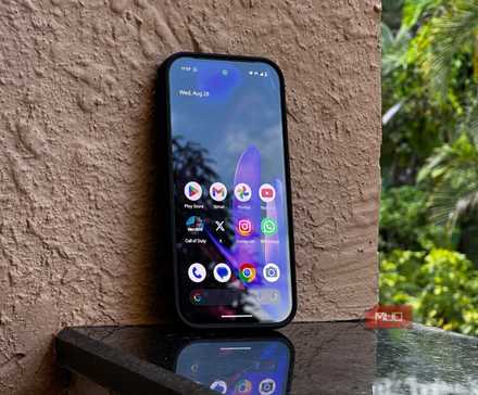 Google Pixel 9 resting against a wall showcasing its display