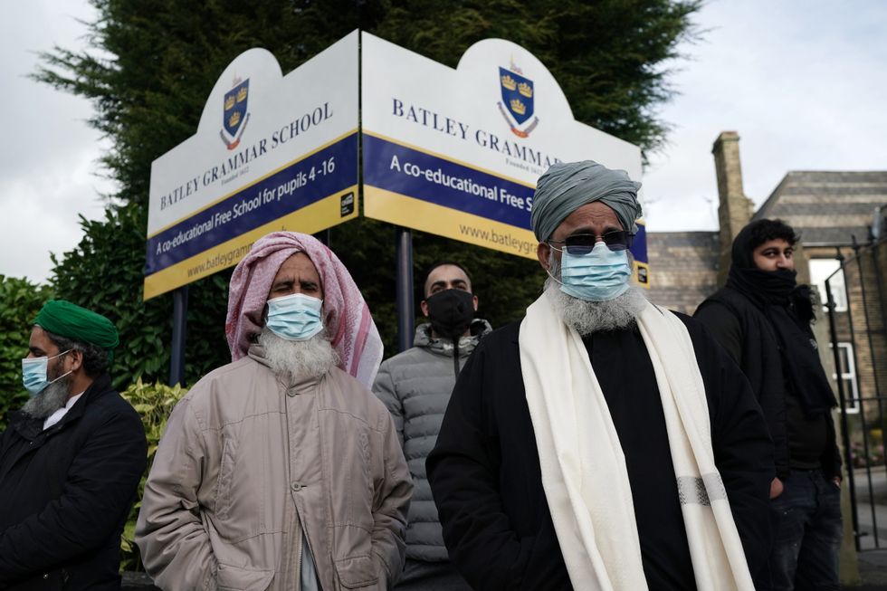 Protesters stand outside the gates Batley Grammar School in 2021