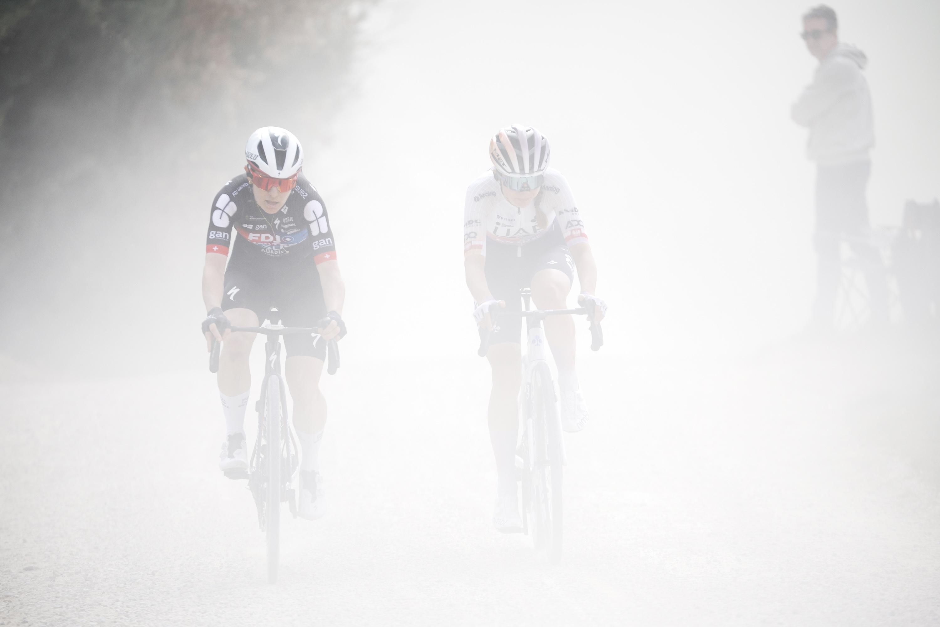 SIENA, ITALY - MARCH 07: (L-R) Elise Chabbey of Switzerland and Team FDJ United - SUEZ and Dominika Wlodarczyk of Poland and UAE Team ADQ compete in the breakaway during to the 12th Strade Bianche Donne 2026 a 133km one day race from Siena to Siena / #UCIWWT / on March 07, 2026 in Siena, Italy. (Photo by Massimo Fulgenzi - Pool/Getty Images)