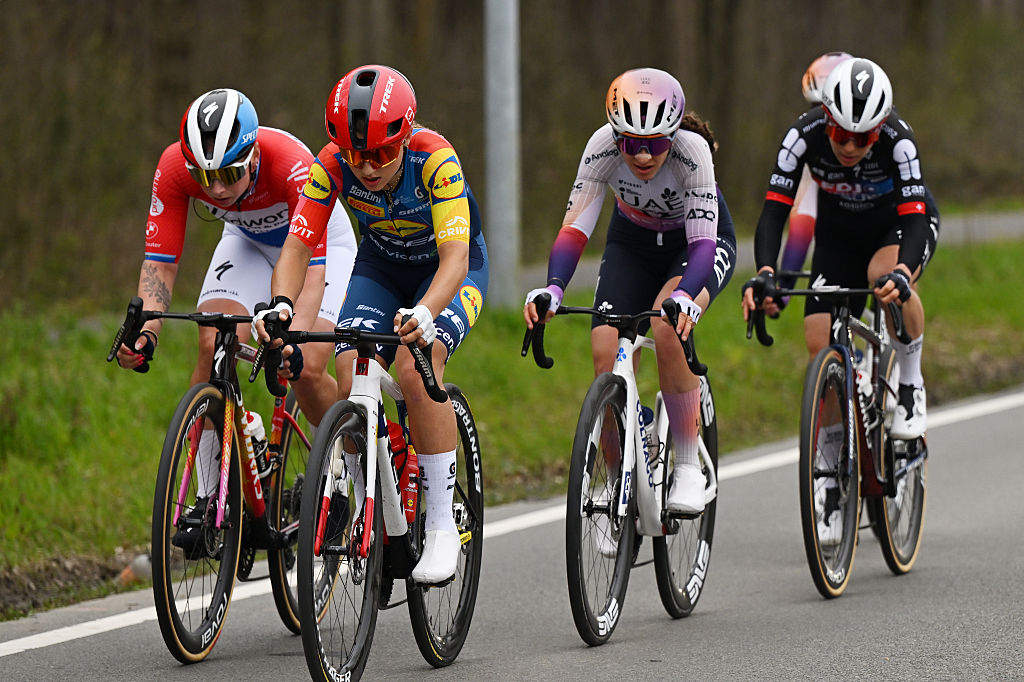Five riders, led by Fleur Moors, ride a flat part of road in the finale of In Flanders Fields 2026