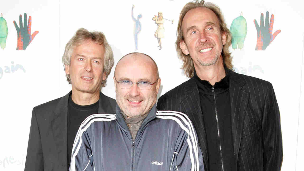 Genesis posing for a photograph at the announcement of their reunion in 2006