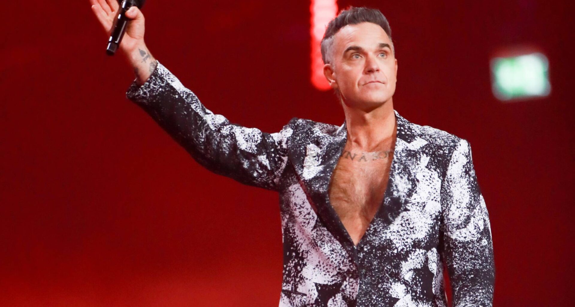 Watch Robbie Williams lead Ozzy Osbourne tribute at BRITs 2026 with 'No More Tears'