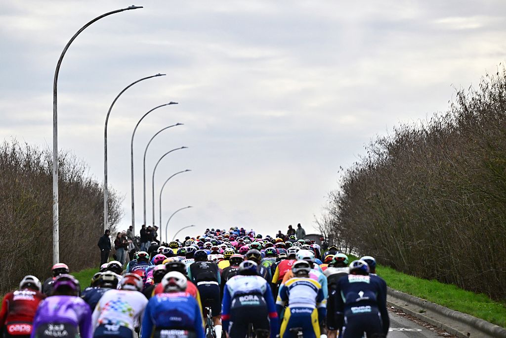 The pack of riders pictured in action during the 78th edition of the men elite race of the Kuurne-Brussels-Kuurne one day cycling race, 195 km from Kuurne to Kuurne via Brussels, Sunday 01 March 2026. BELGA PHOTO DIRK WAEM (Photo by DIRK WAEM / BELGA MAG / Belga via AFP)