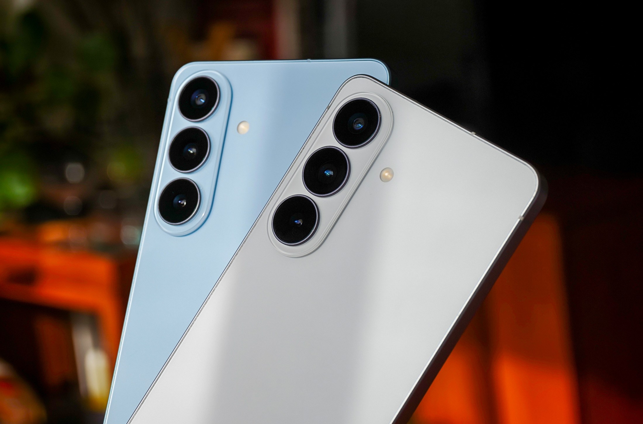 Photo of white Samsung Galaxy S26 and blue Galaxy S26 Plus cameras side by side