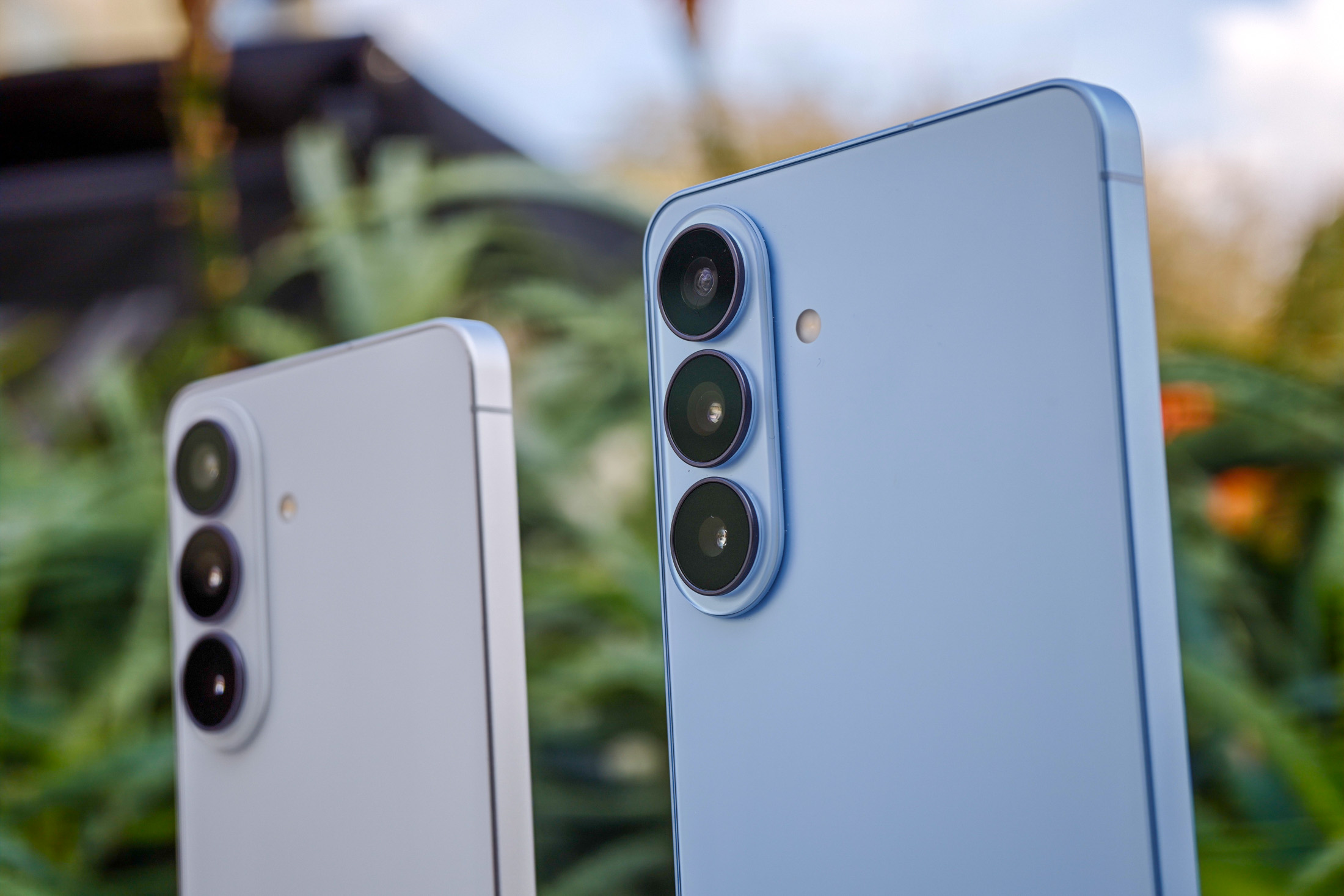 Photo of white Samsung Galaxy S26 and blue Galaxy S26 Plus cameras side by side