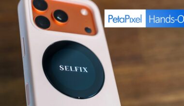 Close-up of a smartphone with three rear cameras and an attached round device labeled "SELFIX," with the Petapixel Hands-On logo in the background.