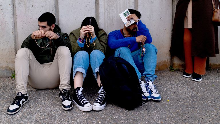 Several people were seen praying outside the care home where Noelia died. Pic: Europa Press/AP