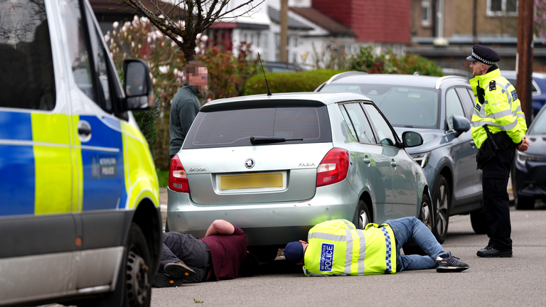 A Skoda is examined in Finchley near a house which has seen police activity. Pic: PA