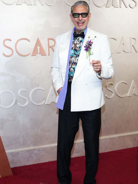 Never afraid to stand out, Jeff Goldblum in a Prada outfit with a lilac scarf in 2025. Pic: Reuters