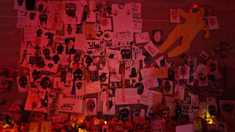 In one room are photographs, messages and teddy bears, echoing the makeshift memorials often left at murder scenes