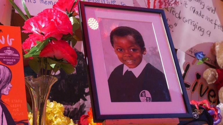 A photo of Sylvia's son, Eugene, is displayed at the installation
