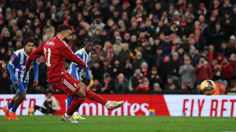 Salah scores Liverpool's third goal from the penalty spot against Brighton & Hove Albion in February. Pic: Reuters