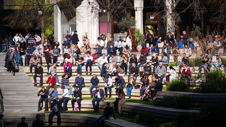 Crowds enjoy the sun near Paddington Station. Pic: PA