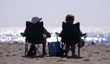 People relax in chairs on the beach in Bournemouth, Dorset. Pic: PA