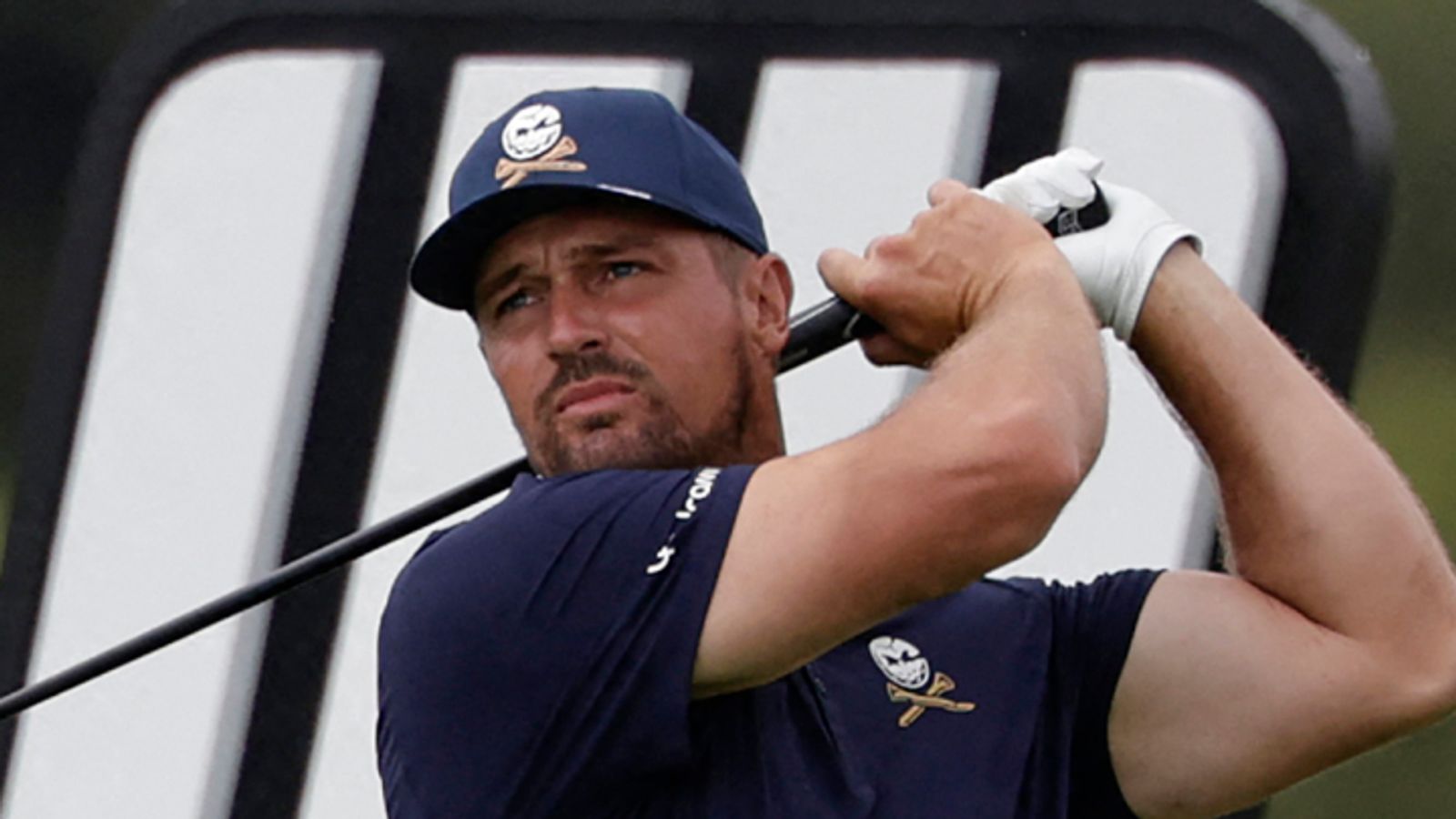 Crushers GC's US player Bryson Dechambeau watches a drive from the 14th tee on the fourth day of the LIV Golf South Africa tournament at The Club in Steyn City on March 22, 2026. (Photo by WIKUS DE WET / AFP)