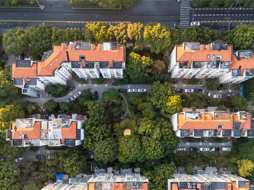 studio RE+N turns abandoned planter into floating yellow stage in shanghai neighborhood - 1