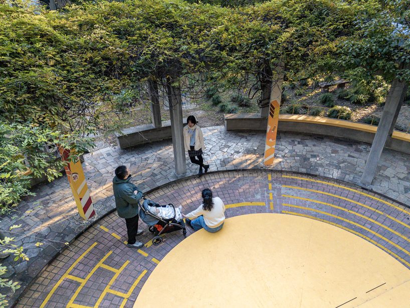 studio RE+N turns abandoned planter into floating yellow stage in shanghai neighborhood - 5