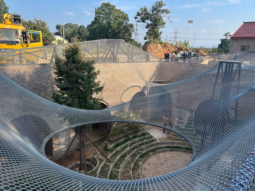 Tensile net canopy over Underground House of the Future