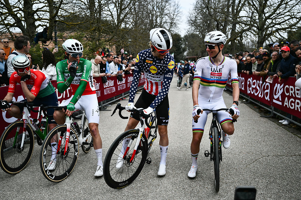 (From 2L) Team Picnic PostNL's Italian Mattia Gaffuri, Lidl-Trek's US Quinn Simmons and UAE Team Emirates's Slovenian Tadej Pogacar wait ahead of the 20th one-day classic 'Strade Bianche' (White Roads) men's cycling race between Siena and Siena in Tuscany on March 7, 2026. (Photo by Marco BERTORELLO / AFP)