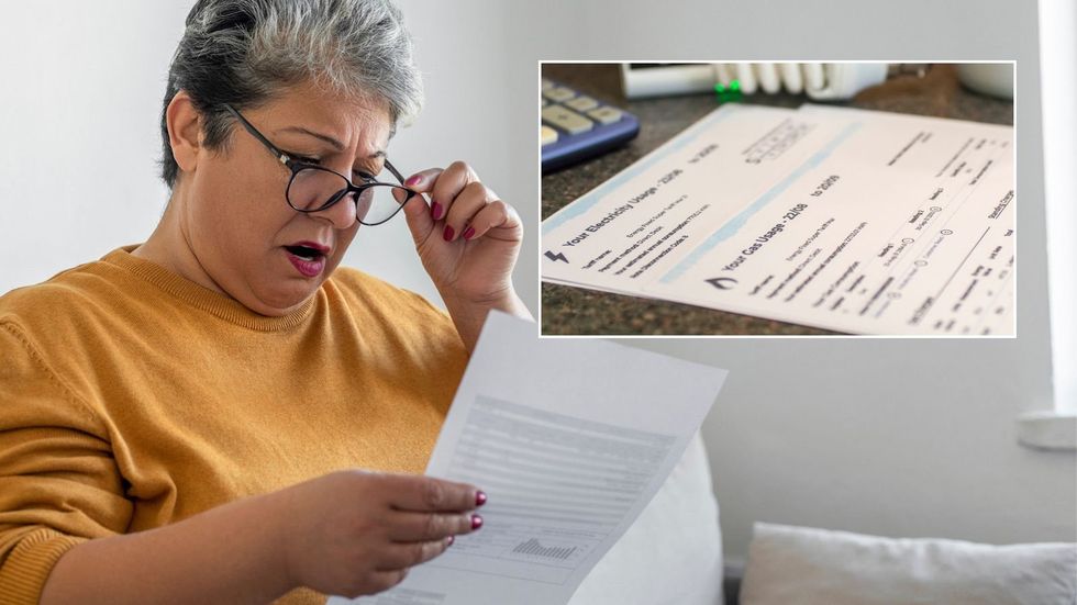 Woman looking at bill and energy bill