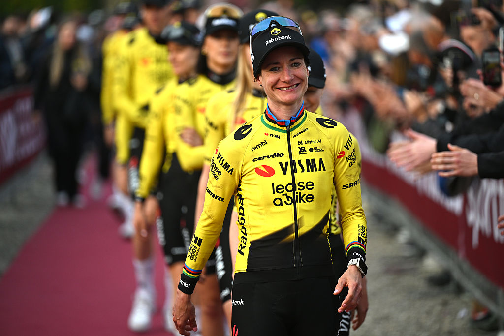 Vos leads the line of Visma riders walking to a team presentation