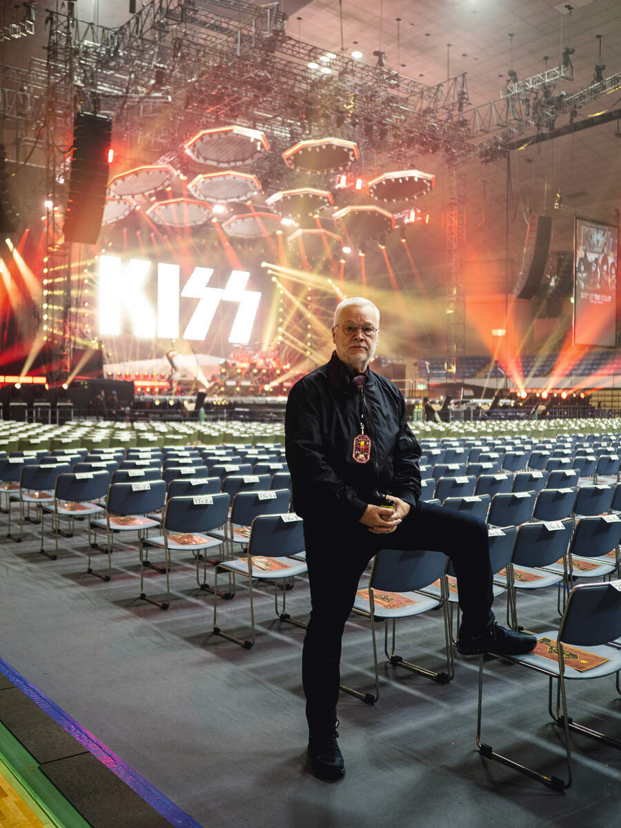 Danny Francis poses in an empty auditorium before a Kiss show