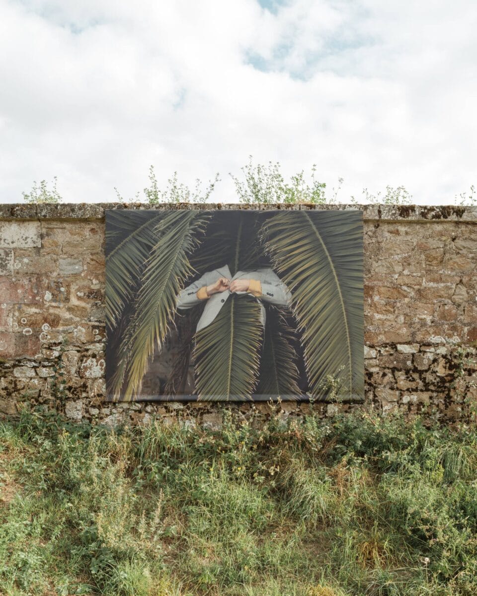an outdoor installation of surreal portraits by photographer Ben Zank