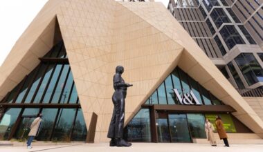 18ft sculpture of teen with smartphone faces down V&A East visitors