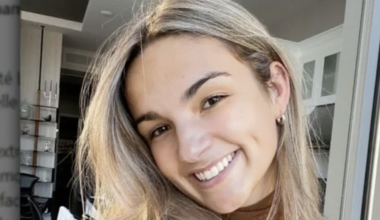 Head and shoulders shot of smiling woman.
