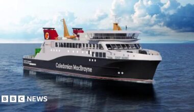 A black and white ship with red funnels