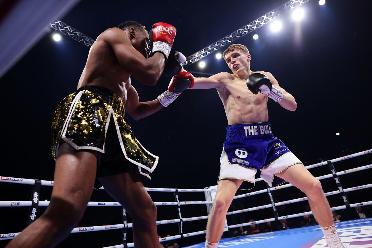 Sam Norris lands a shot on Jahfieus Faure during their fight at the M&S Bank Arena