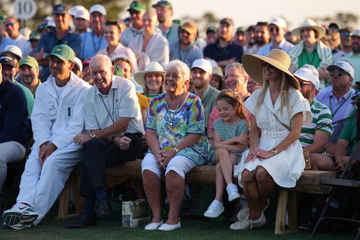 Golf: The Masters:  Rory McIlroy family, caddie and management team (L-R) Sean O'Flaherty his manager, Niall O'Connor (management team), Harry Diamond (caddie) Gerry and Rosie McIlroy (mother and father), Poppy (his daughter) and Erica Stoll (wife) watch on during the presentation after the final round at Augusta National. Augusta, GA 4/12/2026 CREDIT: Erick W. Rasco (Photo by Erick W. Rasco/Sports Illustrated via Getty Images) (Set Number: X164882 TK4)