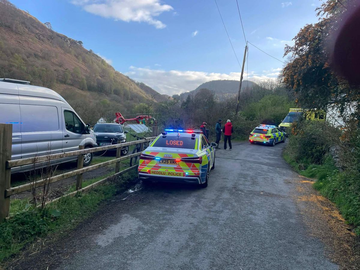 The road was closed by police as an air ambulance landed nearby