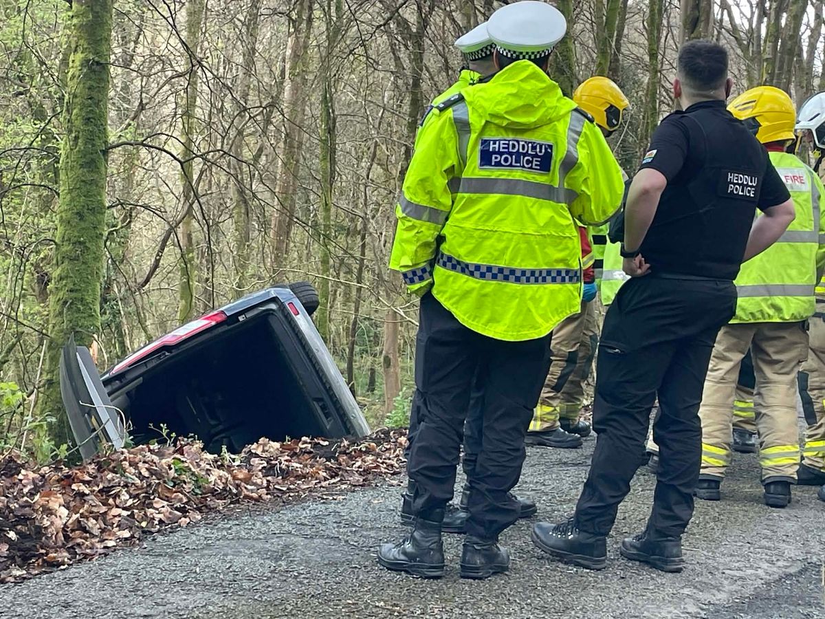 Emergency service personnel survey the damage