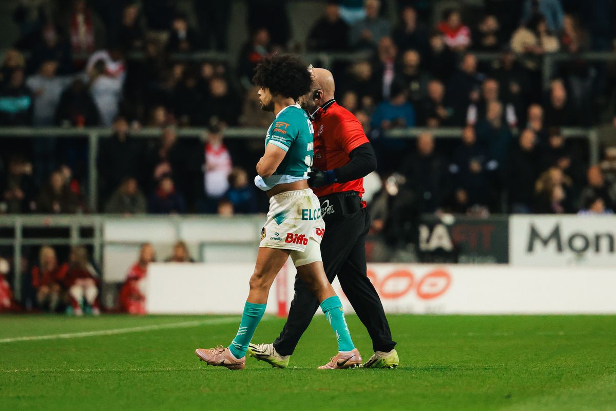 St Helens' Lewis Murphy walks off the field with an injury against Catalans Dragons.