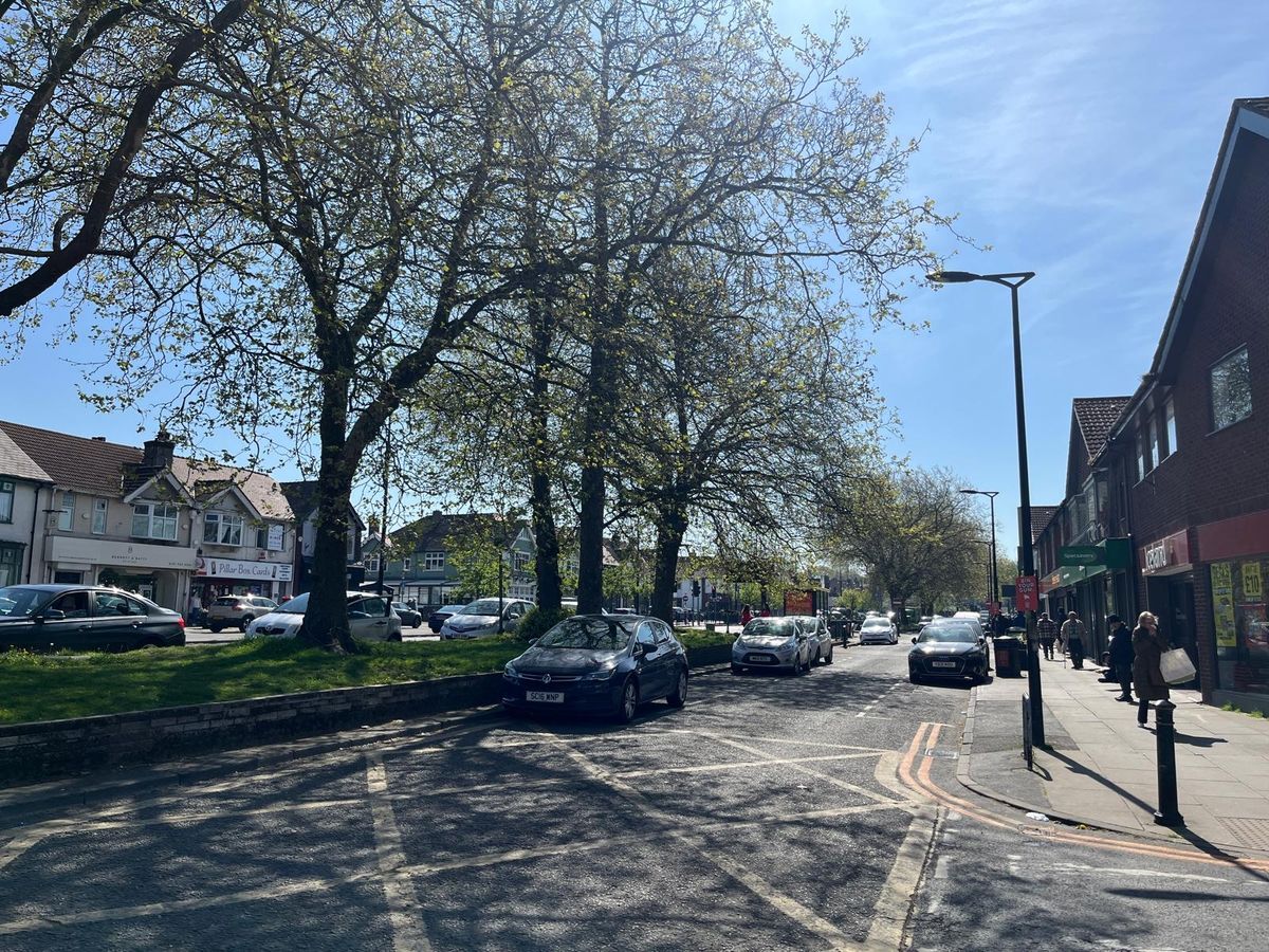 Independent businesses line either side of Allerton Road