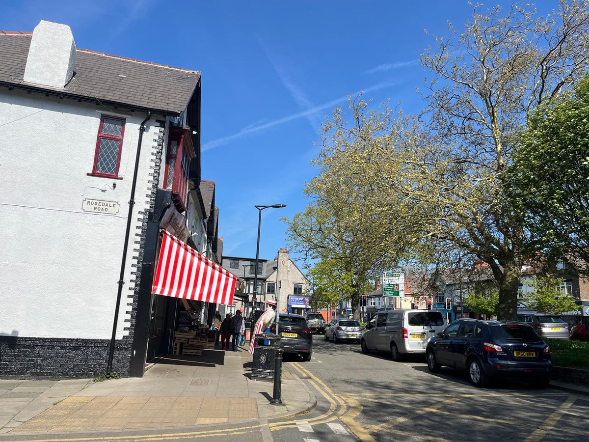 Independent businesses line either side of Allerton Road