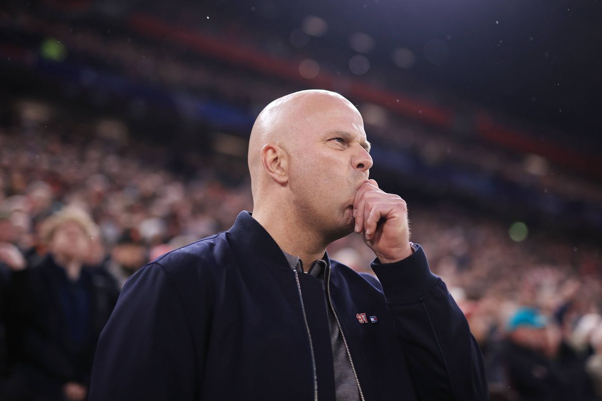 Arne Slot looking concerned on the sideline during a Liverpool match at Anfield