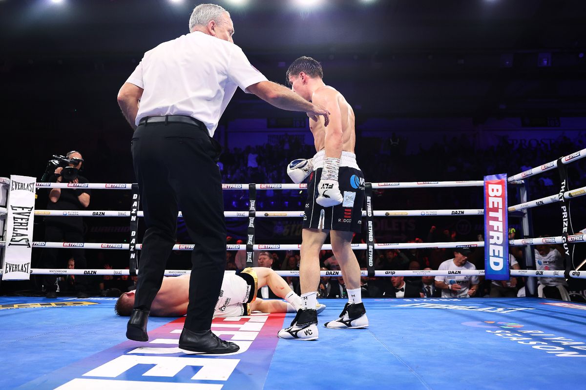 William Crolla stands over Glenn Byrne