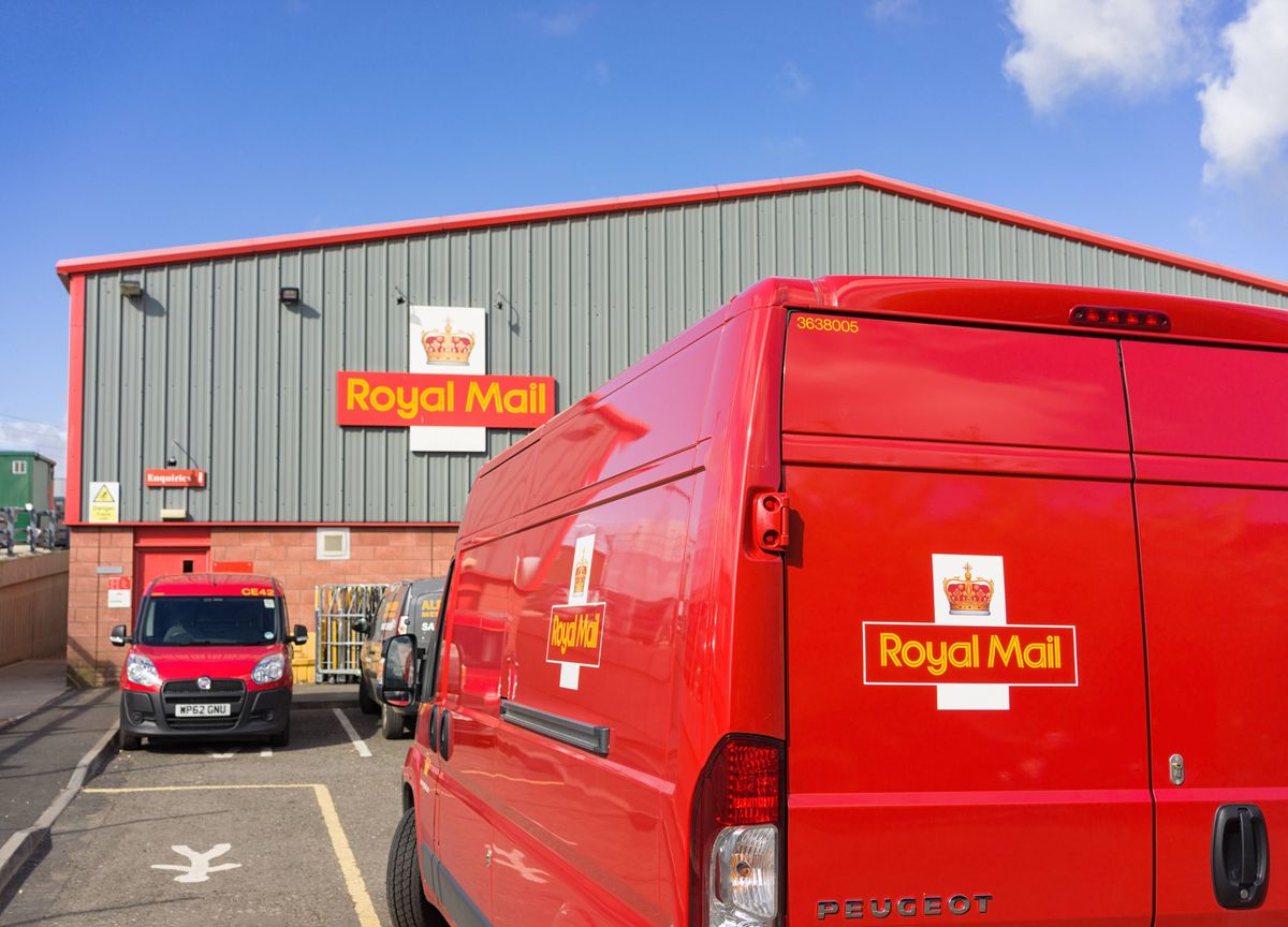 Edinburgh, Scotland, UK - May 6, 2014: A Royal Mail postal van parked outside a Royal Mail building in the Haymarket area of Edinburgh.