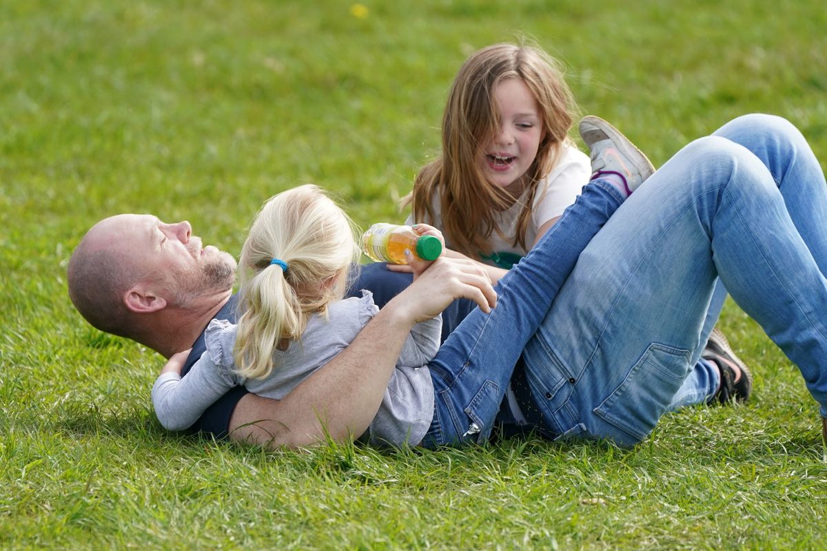 Mike plays with daughters Mia and Lena