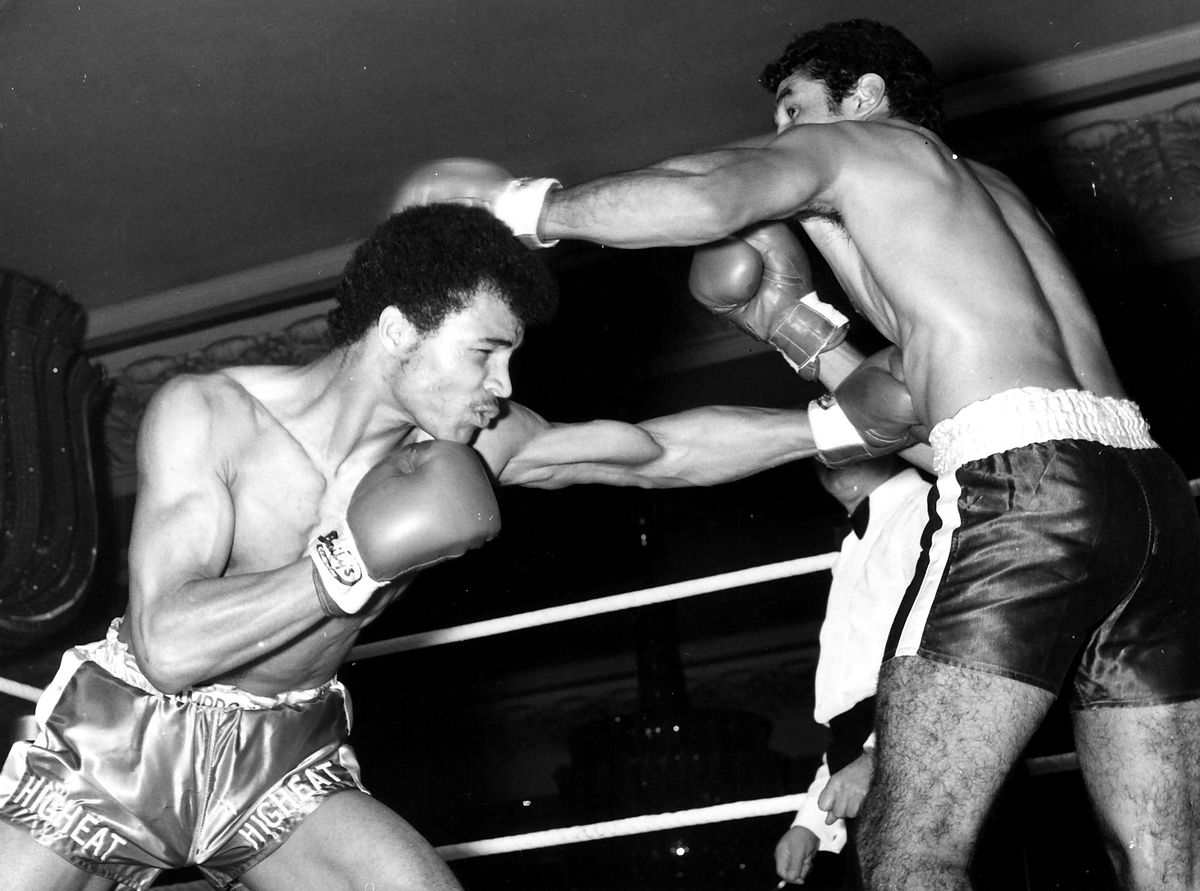 Black and white photo of John Conteh boxing in the ring