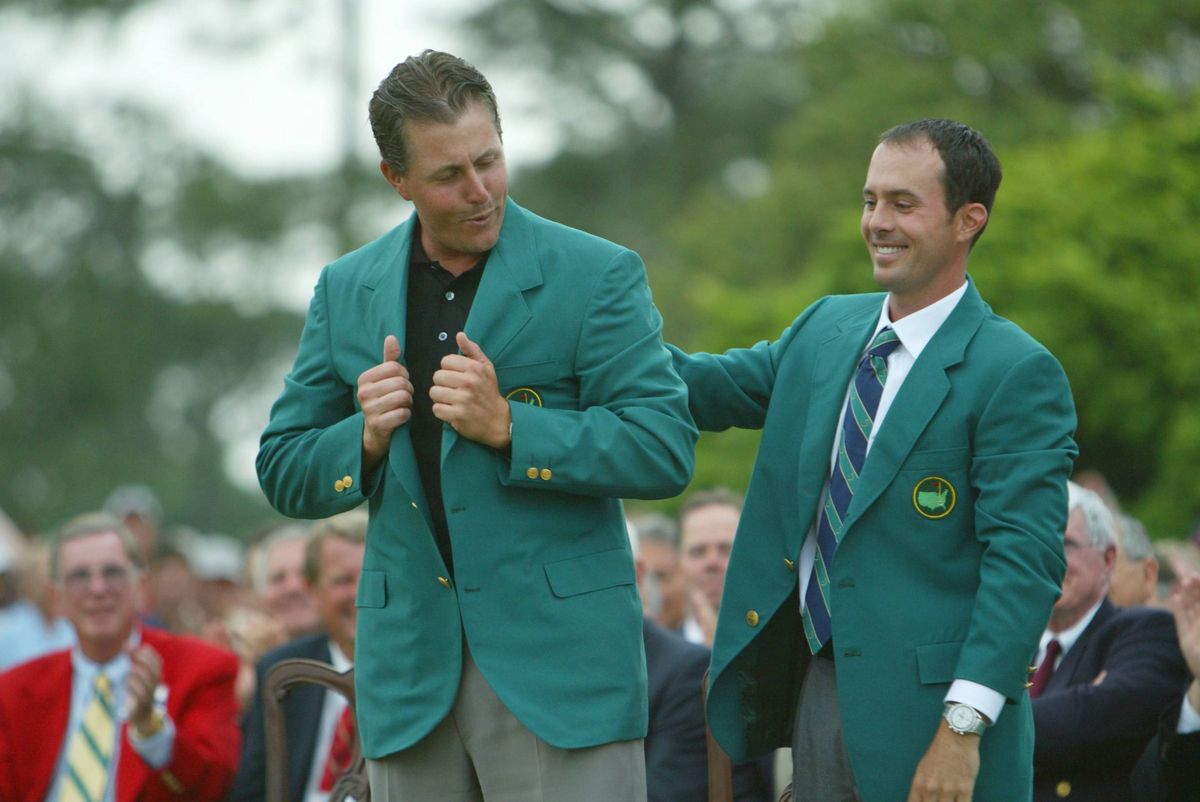 Phil Mickelson victorious in green jacket, with Mike Weir (R) after winning the 2004 Masters
