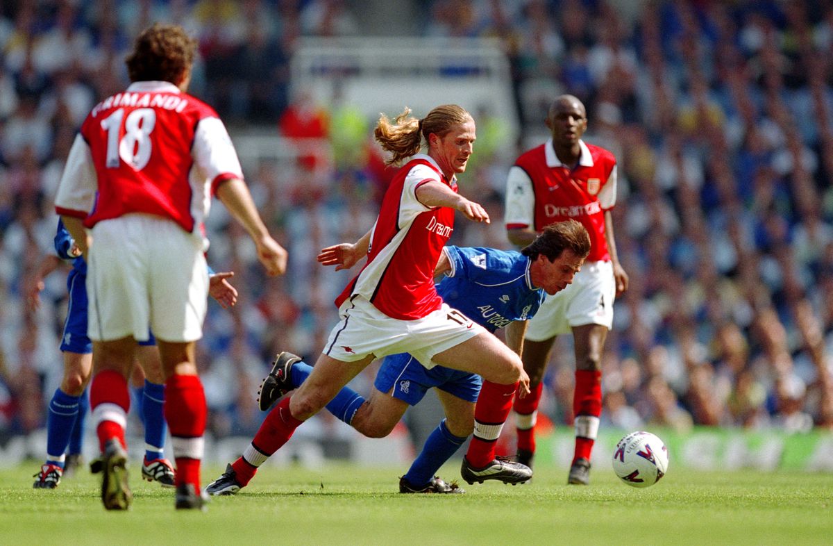 Emmanuel Petit of Arsenal and Gianfranco Zola of Chelsea. 