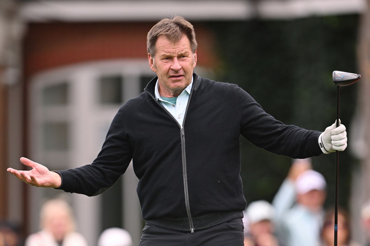 Nick Faldo shrugs his shoulders after hitting a drive