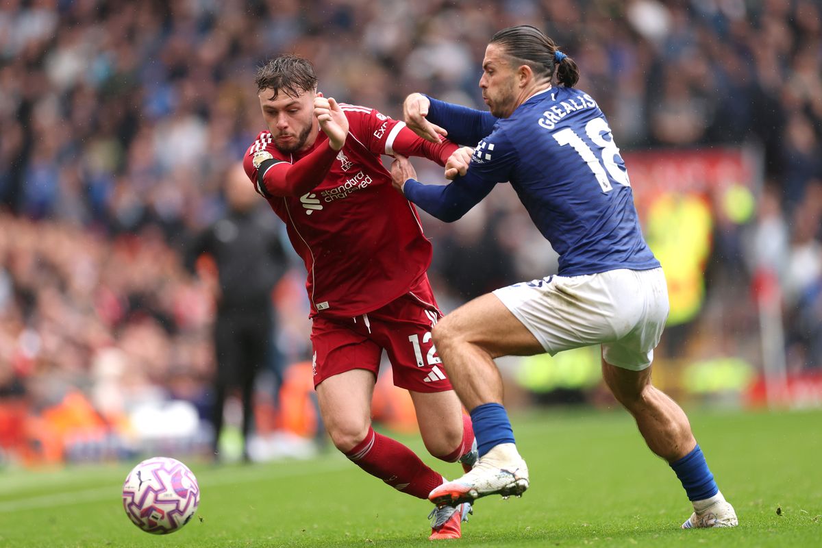 LIVERPOOL, ENGLAND - SEPTEMBER 20: Conor Bradley of Liverpool and Jack Grealish of Everton battle for the ball during the Premier League match between Liverpool and Everton at Anfield on September 20, 2025 in Liverpool, England. (Photo by Carl Recine/Getty Images)