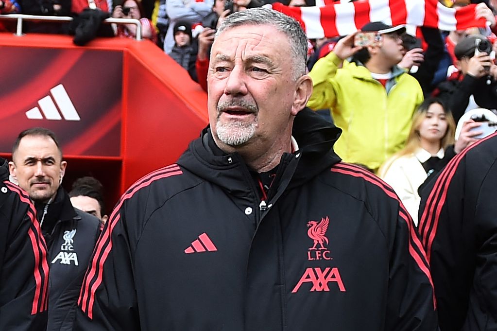 Liverpool management team (L-R) Liverpool Legends' manager Kenny Dalglish, Liverpool Legends' manager Ian Rush, guest, Liverpool Legends' manager John Aldridge and Liverpool Legends' manager Jurgen Klopp, line up ahead of the Legends football match between Liverpool Legends and Dortmund Legends at Anfield in Liverpool, north-west England on March 28, 2026. (Photo by PETER POWELL / AFP via Getty Images)