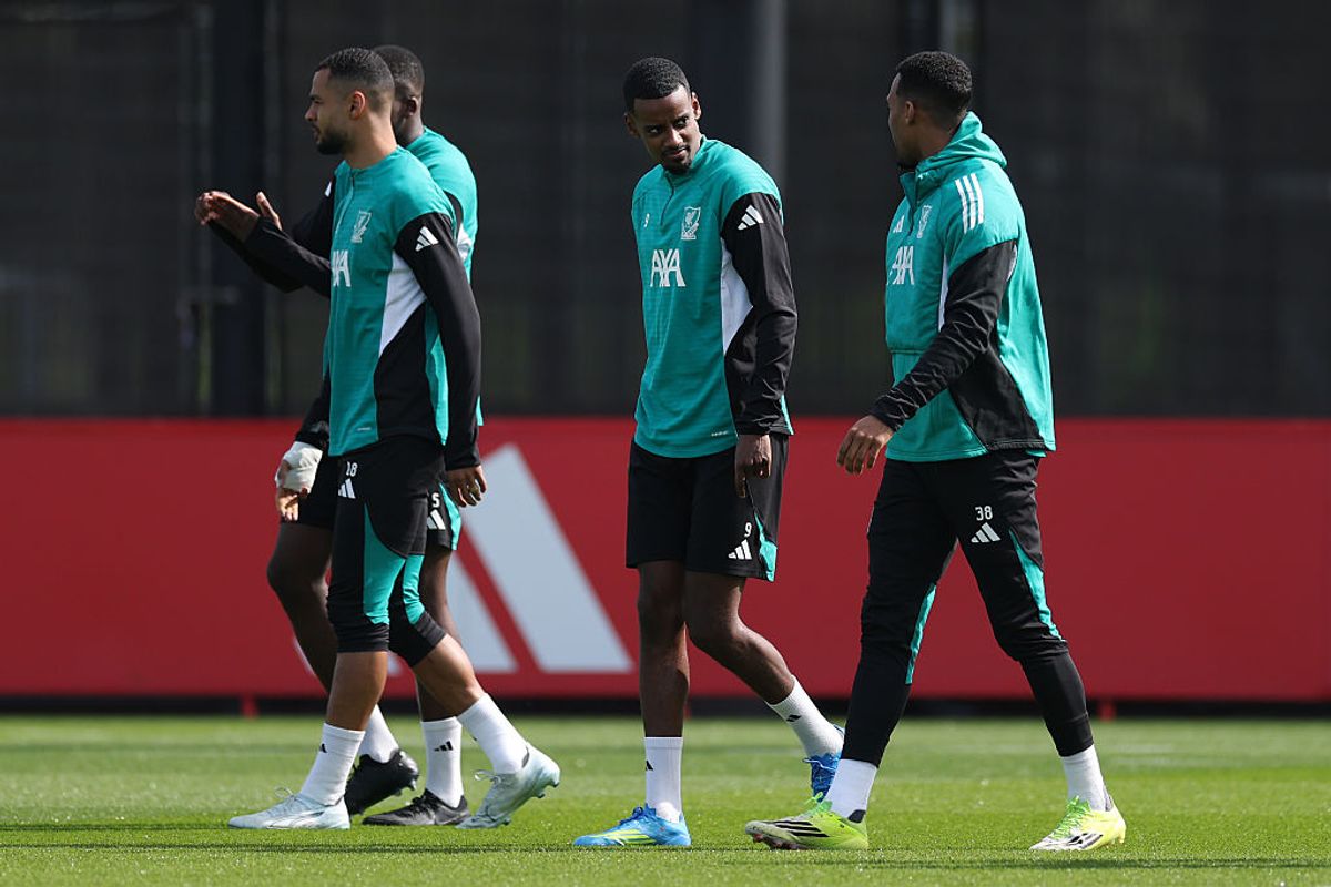 Alexander Isak of Liverpool speaks to team mate Ryan Gravenberch (Photo by Jan Kruger/Getty Images)