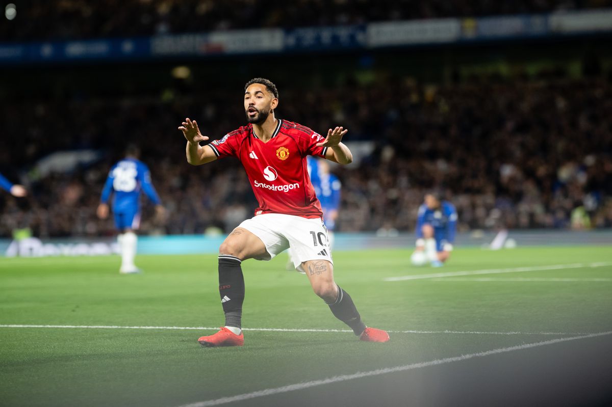 Matheus Cunha of Manchester United celebrates scoring their first goal during the Premier League match between Chelsea and Manchester United at Stamford Bridge on April 18, 2026 in London, England.