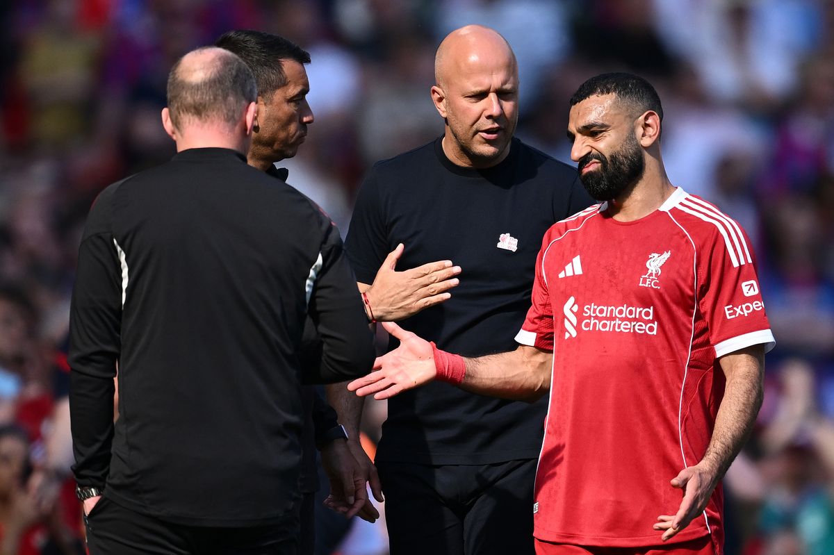 LIVERPOOL, ENGLAND - APRIL 25: Mohamed Salah of Liverpool reacts with Arne Slot, Manager of Liverpool, after being substituted off during the Premier League match between Liverpool and Crystal Palace at Anfield on April 25, 2026 in Liverpool, England. (Photo by Gareth Copley/Getty Images)